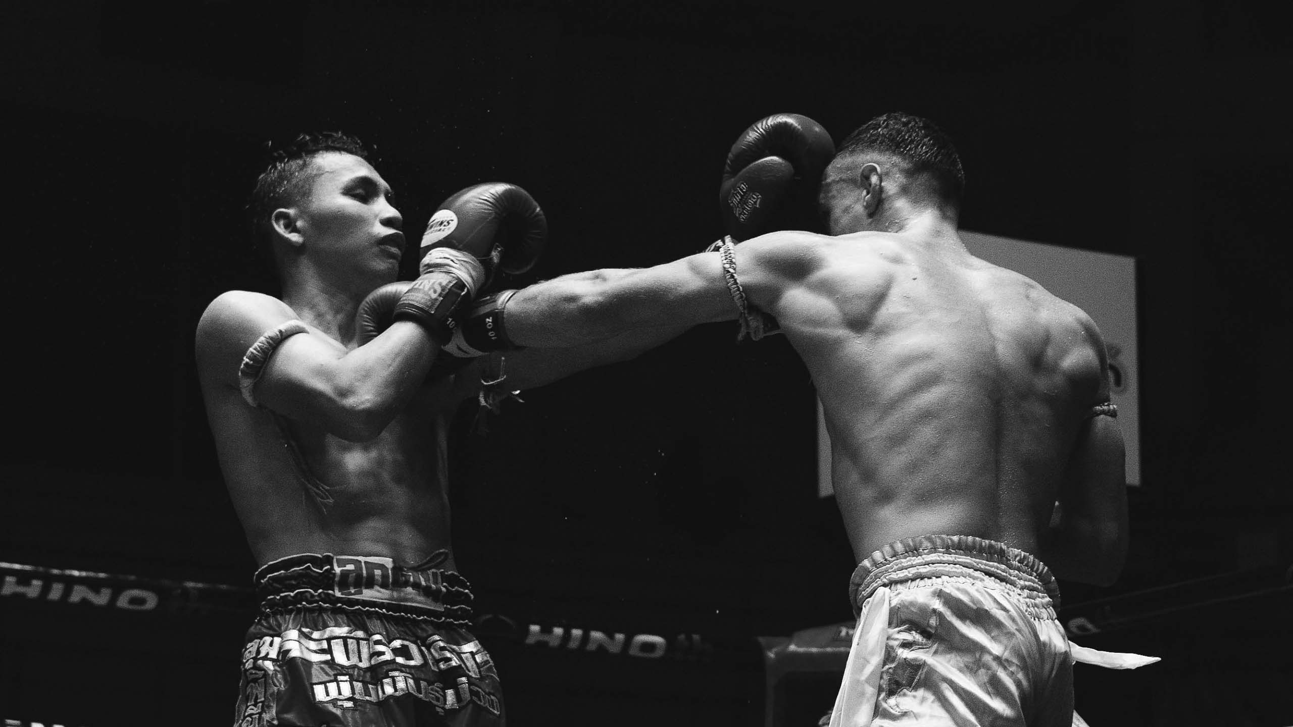 Ring action fighting in a Muay Thai stadium bout in Chiang Mai Thailand