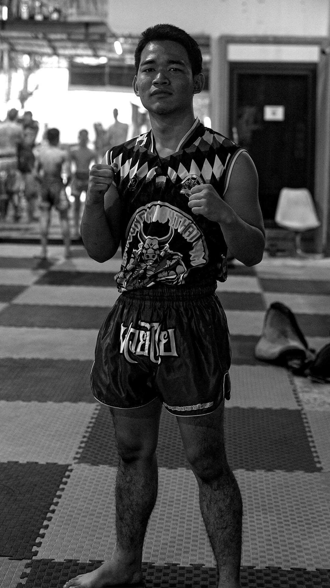 Trainer ready to practice boxing techniques during Muay Thai training at Rambong Muay Thai Gym