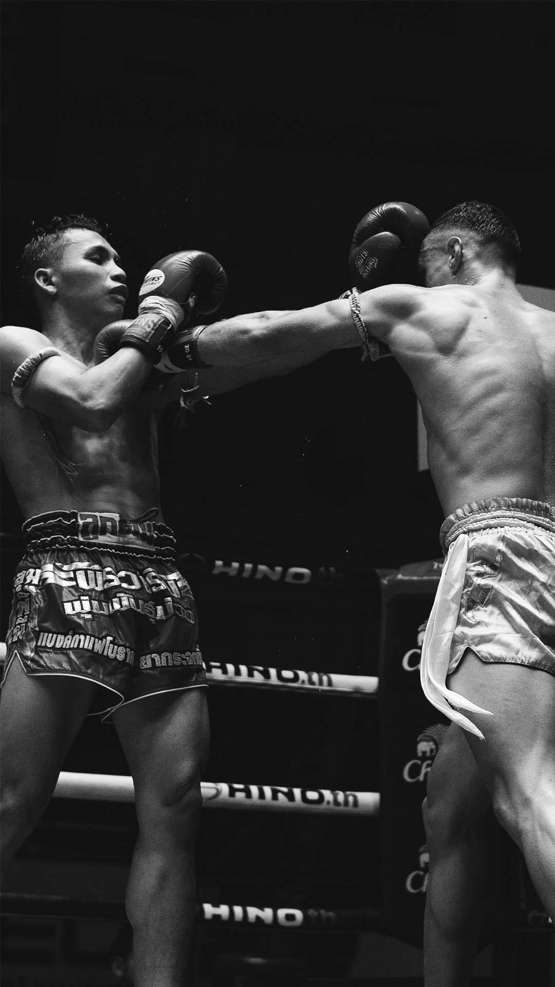 Ring action fighting in a Muay Thai stadium bout in Chiang Mai Thailand