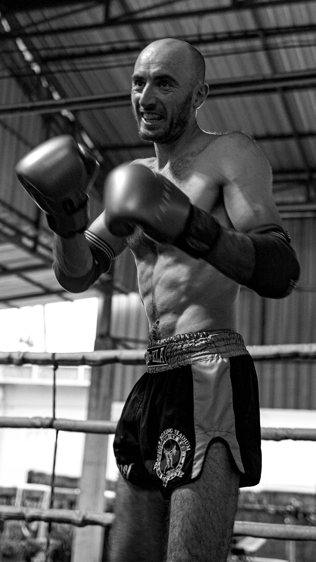 Muay Thai fighter standing in a ready stance inside Rambong Muay Thai Gym