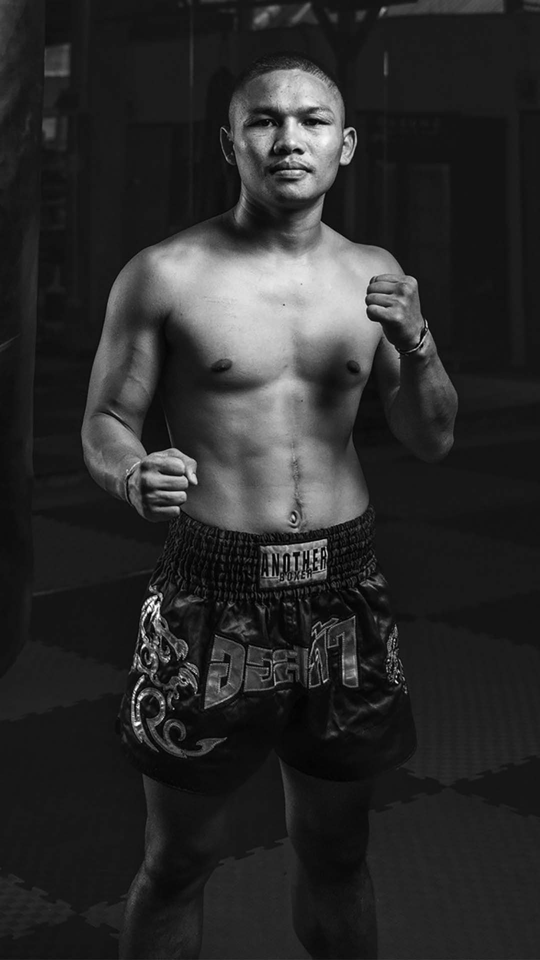 Rambong Therapat posing in a Muay Thai stance at Rambong Muay Thai Gym in Chiang Mai